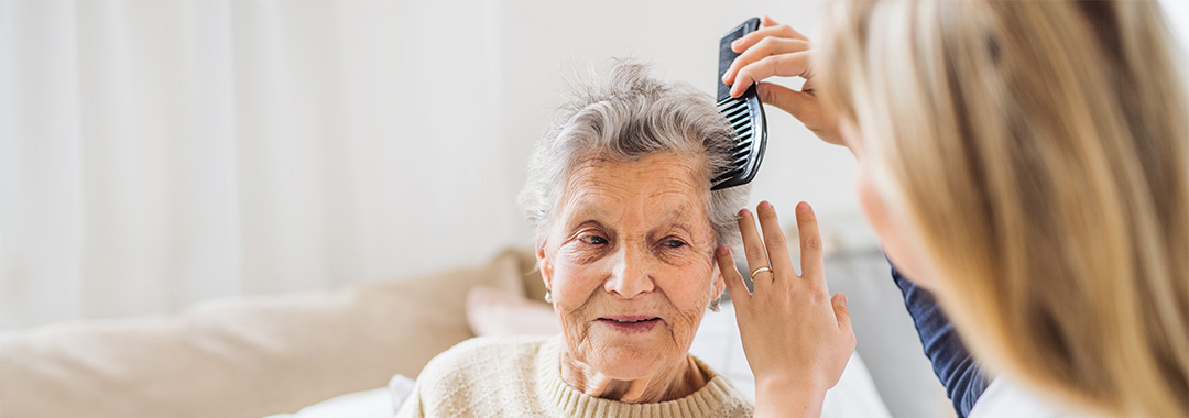 a woman having her hair brushed